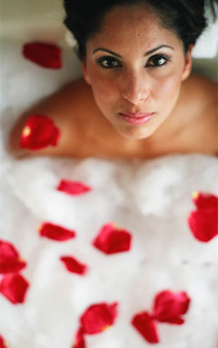 Red Flower Petals With Woman Bathing